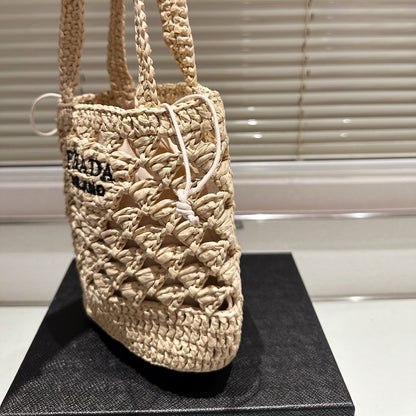 CROCHET BUCKET BAG 18 IN BEIGE WOVEN RAFFIA EMBROIDED LOGO