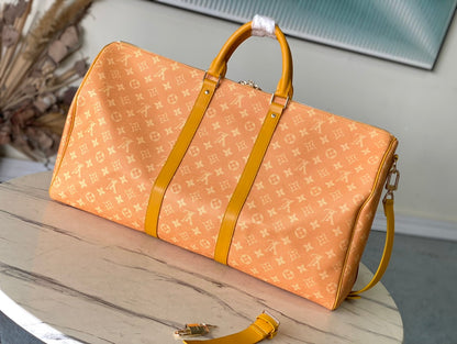KEEPALL BANDOULI_RE 55 IN ORANGE MONOGRAM HERITAGE CANVAS